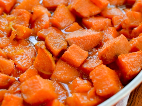Sweet potato casserole topping with glazed roasted sweet potatoes in a baking dish, delicious and seasonal.
