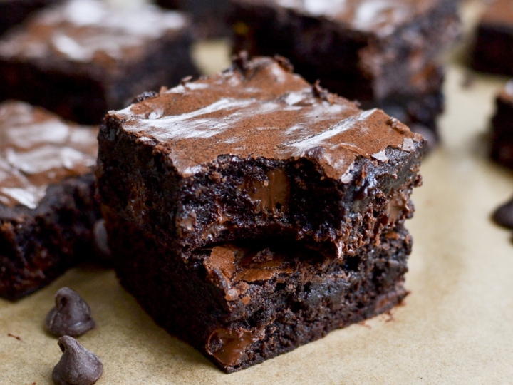 Rich, gooey double chocolate brownies with melted chocolate chips, perfect for chocolate lovers. Homemade chocolate dessert from Stuck On Sweet, ideal for bakery treats and sweet snack cravings.