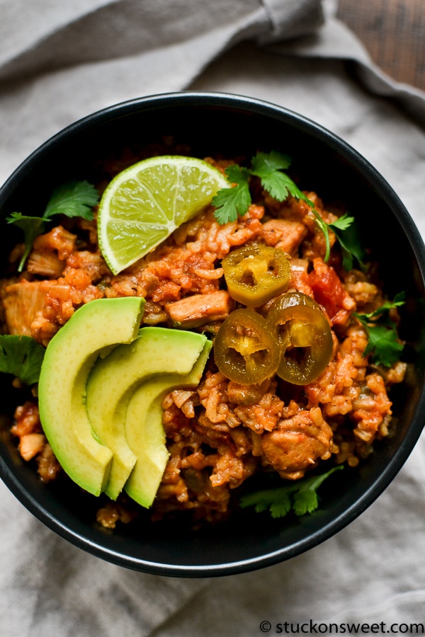 Creamy Mexican Chicken and Rice Bowl with Avocado, Jalapeños, and Lime.