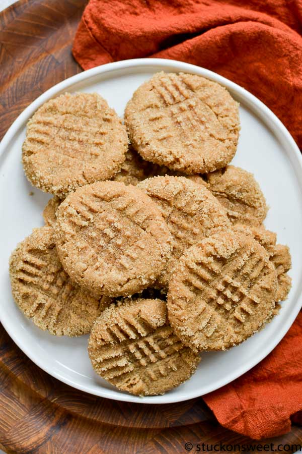 Soft peanut butter cookies with crisscross pattern on a white plate, perfect for sweet treats and baking; ideal for peanut butter lovers and cookie enthusiasts.