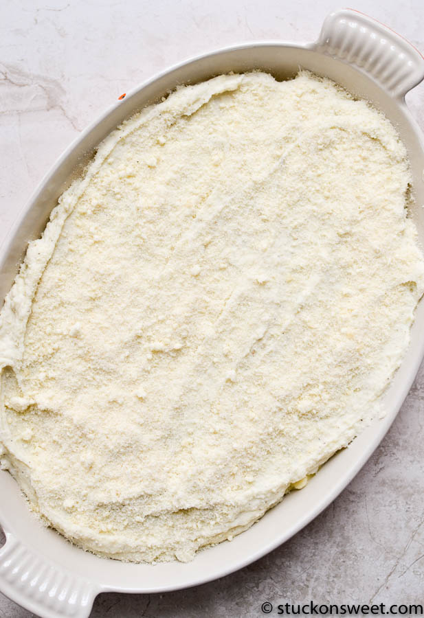 Rich layered casserole dish covered with a creamy mashed potato topping, ready to be baked or served, showcasing comfort food classics perfect for family dinners.