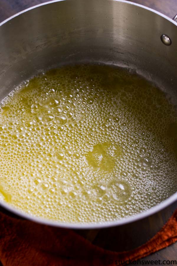 Buttered melted butter in a saucepan, ready for cooking or baking.