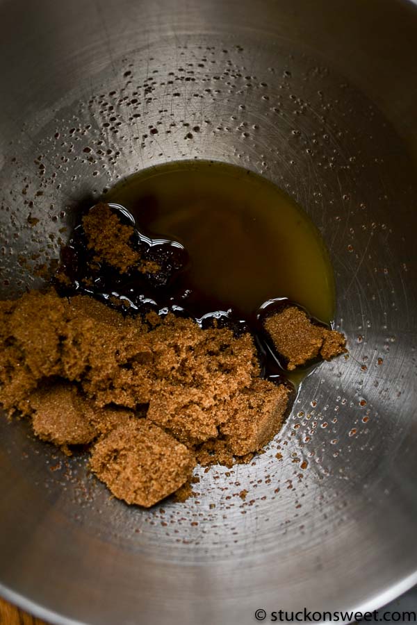 Softened brown sugar and molasses in a mixing bowl, ready to make cookie dough or caramel.