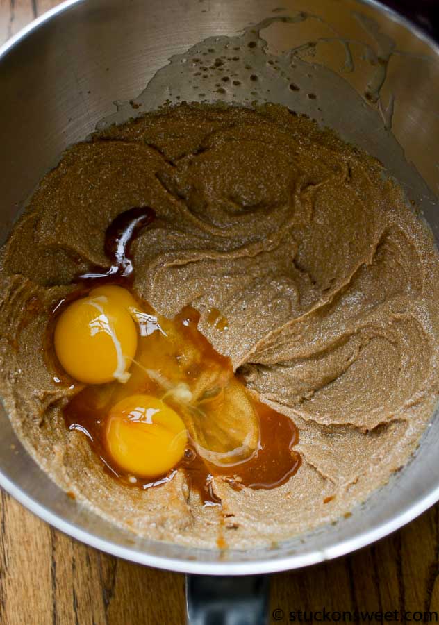 Creamy cookie dough mixture with eggs in a mixing bowl, ready for baking or dessert preparation.