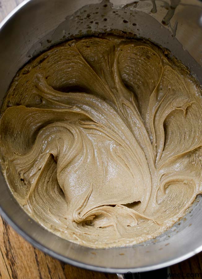 Creamy peanut butter cookie dough in mixing bowl ready for baking, homemade cookie ingredients, sweet treat preparation, dessert baking, kitchen cooking scene.