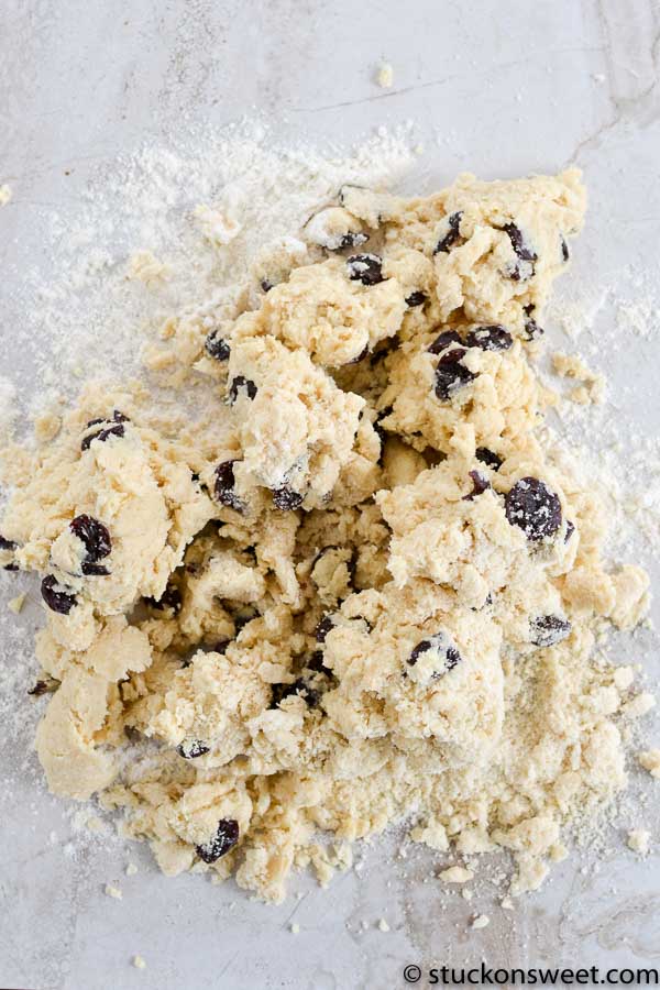 Rich, buttery cookie dough with chocolate chips on a marble surface, ready for baking or chilling. Perfect for homemade cookie recipes and sweet treats.