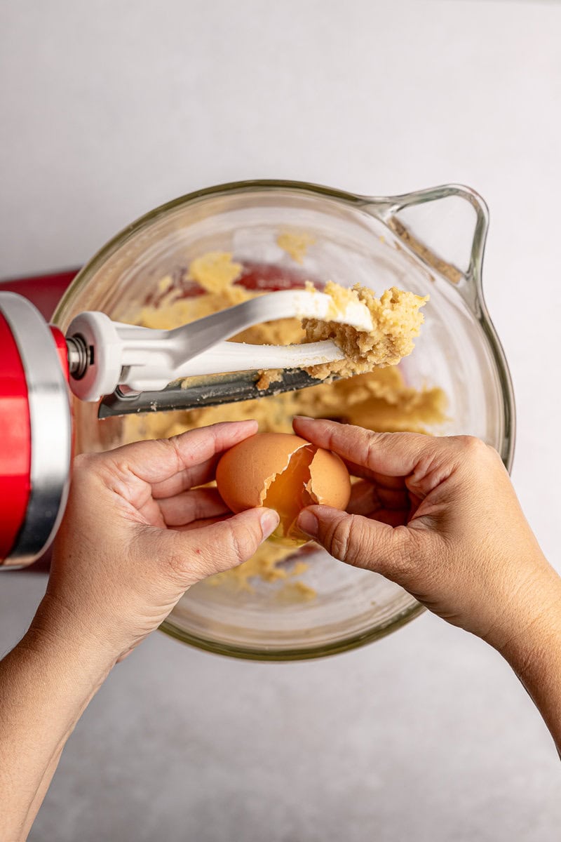 Creamy cookie dough being mixed with an egg at Stuck On Sweet.