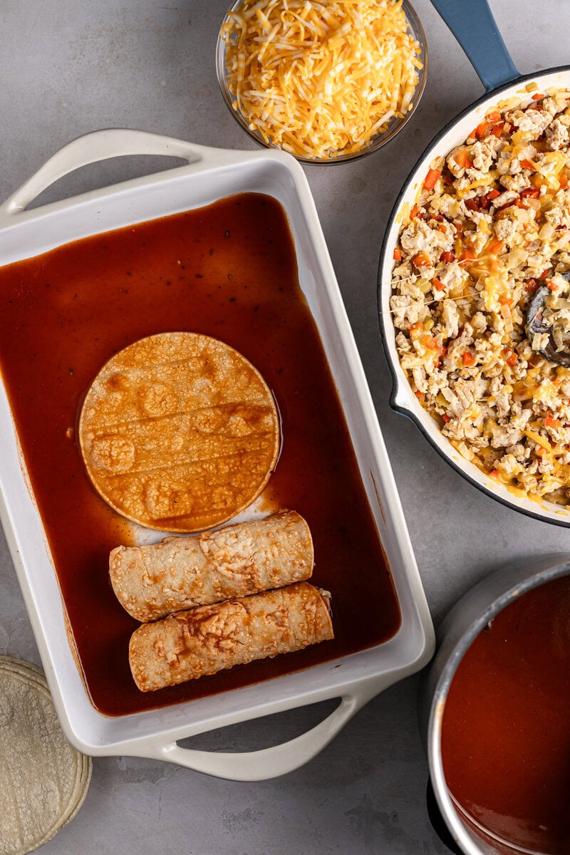 Rich beef enchiladas with red sauces and melted cheese, mexican-style comfort food, homemade enchiladas recipe, cheesy enchiladas with ground beef and spices.