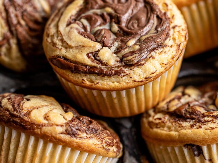 Decadent chocolate marble muffins with swirls of rich chocolate and vanilla batter, perfect for breakfast, snack, or dessert. Moist, flavorful, and topped with a delightful marbled pattern.