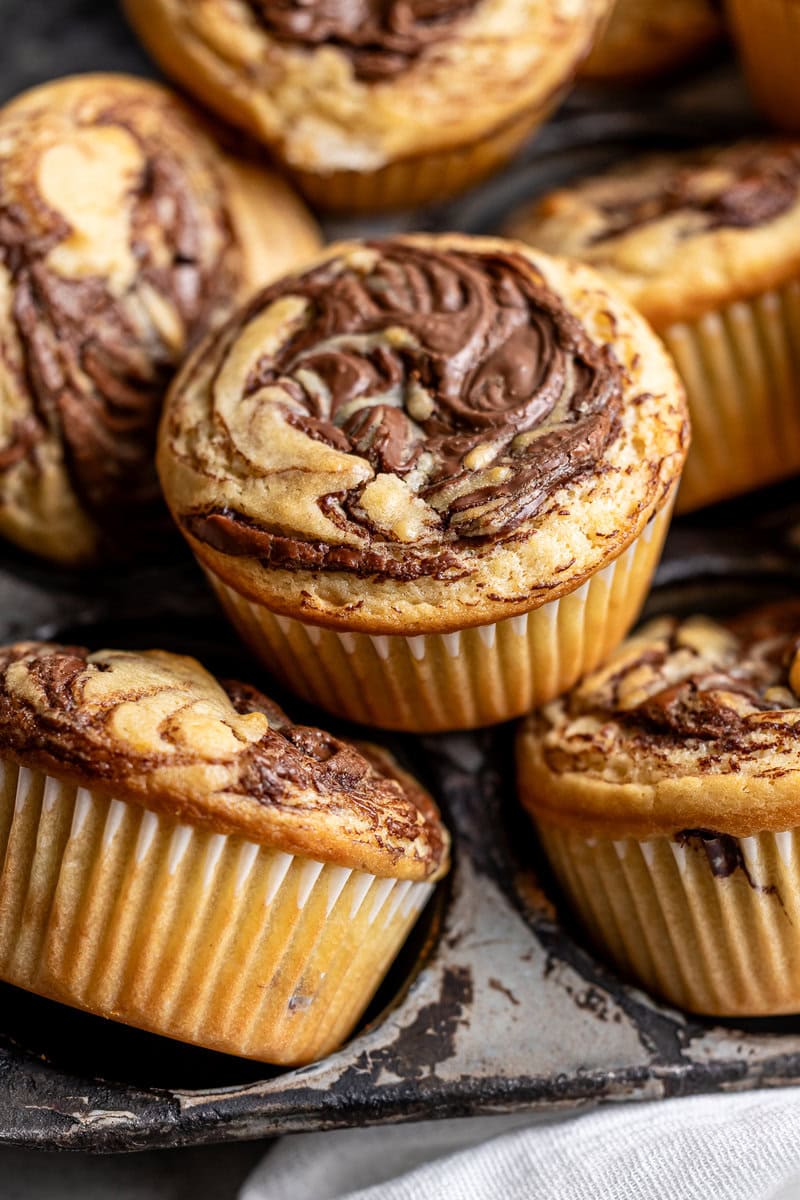 Decadent chocolate marble muffins with swirls of rich chocolate and vanilla batter, perfect for breakfast, snack, or dessert. Moist, flavorful, and topped with a delightful marbled pattern.