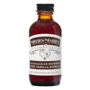 Rich Madagascar bourbon vanilla extract in a dark amber glass bottle for premium baking and cooking.