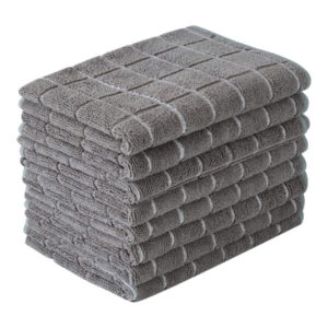 Soft gray hand towels stacked neatly for bathroom or kitchen use, made of plush, absorbent cotton, ideal for home or spa settings.