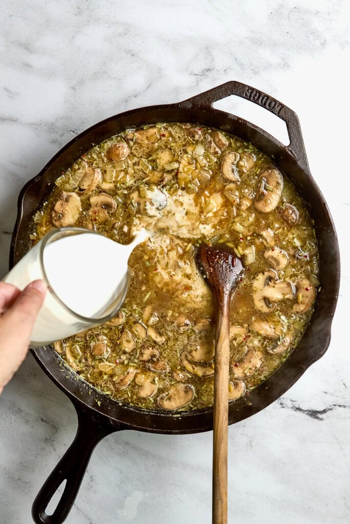 Savory mushroom and herb skillet dish with poured cream, recipe for delicious mushroom cream sauce or mushroom soup.