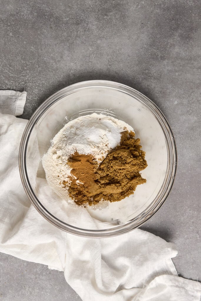Delicious cookie dough with brown sugar, flour, and spices ready for baking or chilling. Perfect for creating homemade cookies with rich, sweet, and spicy flavors.