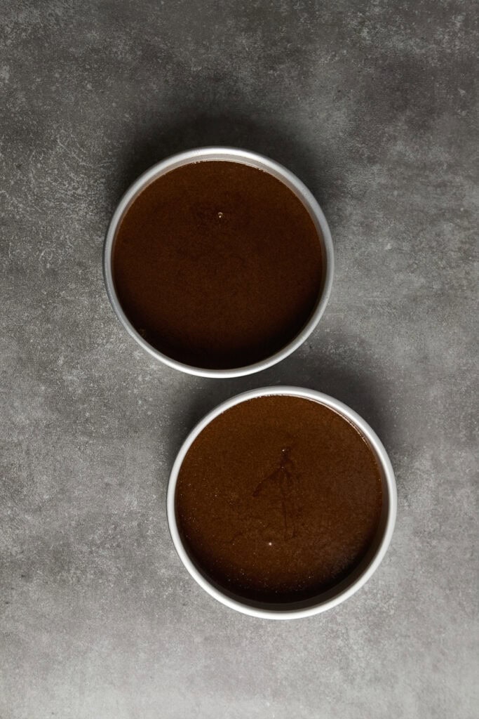 Close-up of two cups of hot coffee on a gray surface. Perfect for coffee lovers, caffeine enthusiasts, or cafe menus, highlighting fresh brewed coffee.