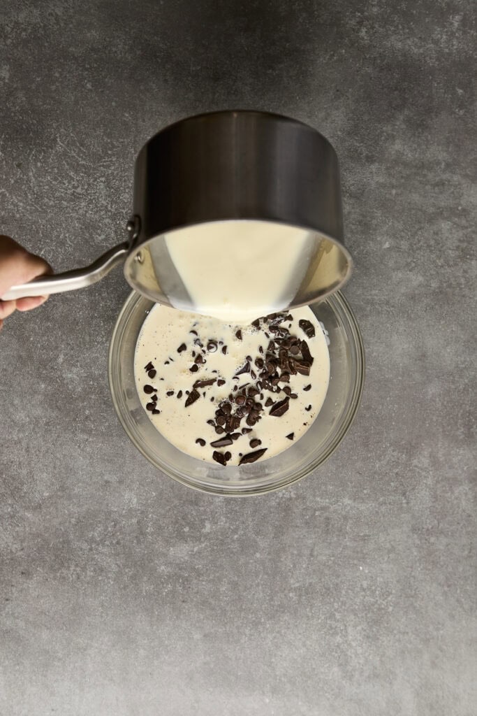 Rich white chocolate and dark chocolate chips melting into a smooth ganache.