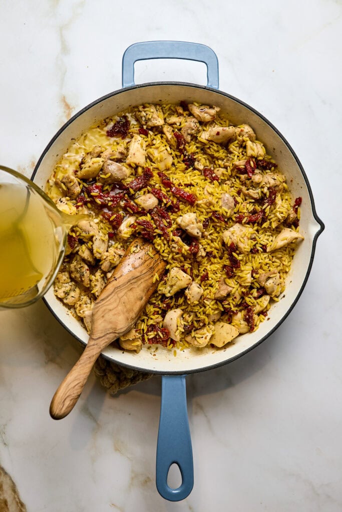 Delicious homemade fried rice with tender chunks of chicken, sun-dried tomatoes, and flavorful seasonings, perfect for a comforting meal or dinner.