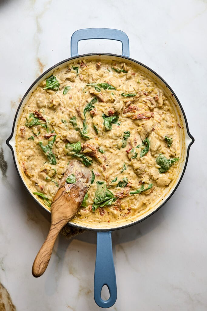 Delicious creamy chicken pasta with spinach and sun-dried tomatoes in a rich, flavorful sauce, easy to make in one skillet. Perfect comfort food recipe, great for weeknight dinners, featuring tender chicken and fresh greens.