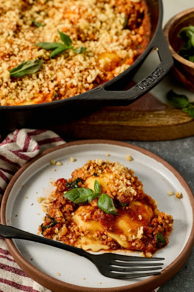 Ground beef and spinach ravioli skillet recipe on a white plate