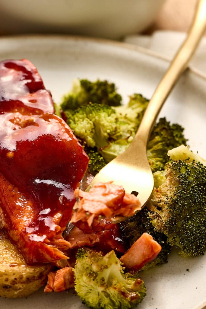 Sweet barbecue glazed salmon served with fresh broccoli and roasted potatoes, highlighting a healthy and flavorful meal option from Stuck On Sweet.