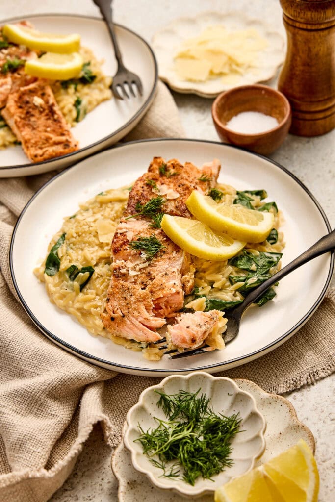 Delicious salmon piccata served with lemon slices, creamy mashed potatoes, and fresh herbs on a rustic table setting. Perfect for a flavorful, healthy dinner.