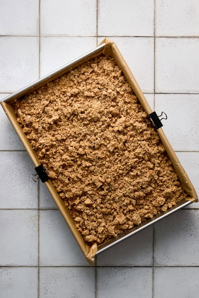 Close-up of a cinnamon coffeee cake with crumb topping in a 9x13 inch pan before being baked.